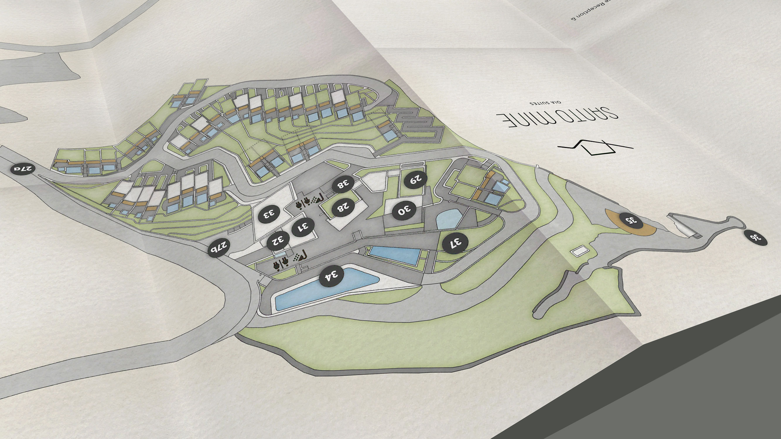 Detail of Santo Mine showing numbered suites, pools and facilities on the paper map.